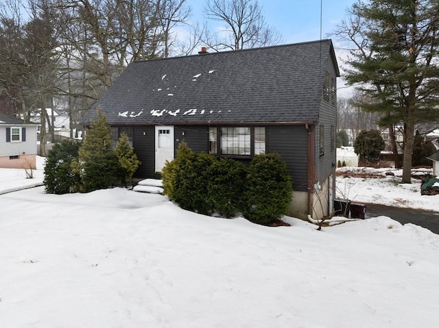 view of front of property with roof with shingles