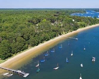 1243 Main St Unit 1243, Barnstable, MA 02635 - birds eye view of property with a wooded view and a water view