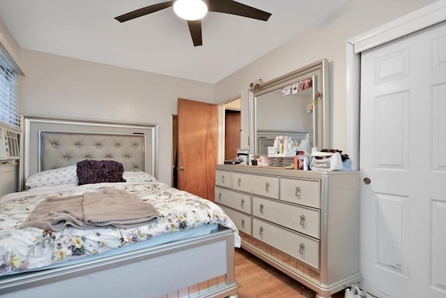 bedroom with light wood-type flooring and ceiling fan