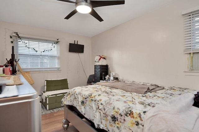 bedroom with wood finished floors and ceiling fan