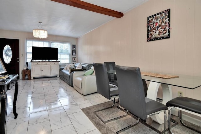 dining space featuring light marble finish floors, beamed ceiling, and wood walls