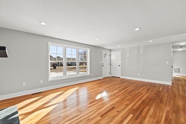 unfurnished living room featuring light wood-type flooring