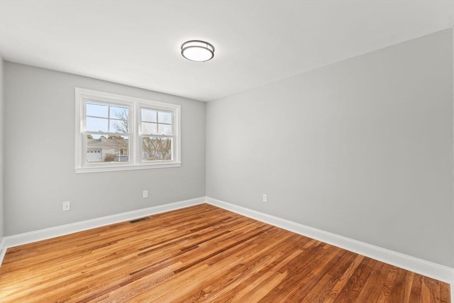 unfurnished room featuring light hardwood / wood-style floors