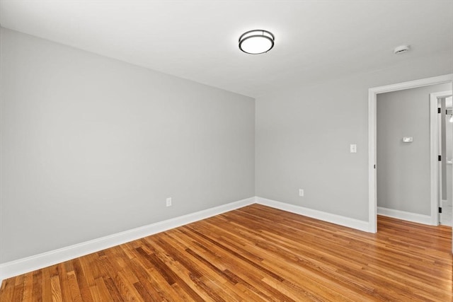 spare room with light hardwood / wood-style flooring