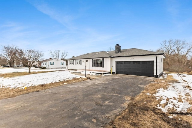 ranch-style home featuring a garage