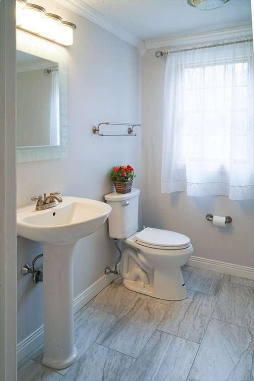 6 Sunrise, Auburn, MA 01501 - half bathroom with ornamental molding, toilet, baseboards, a sink, and marble look tile flooring