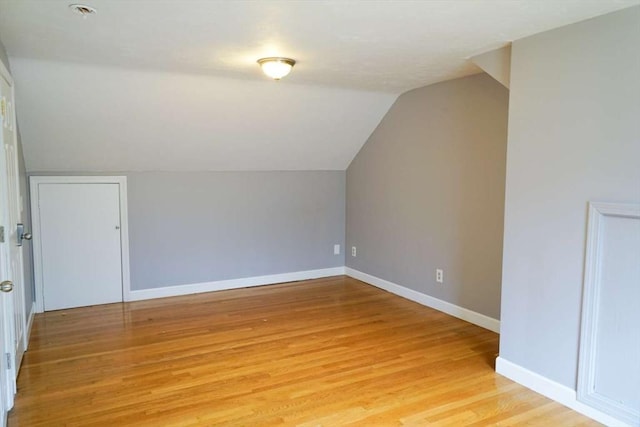 6 Sunrise, Auburn, MA 01501 - additional living space with vaulted ceiling, light wood-type flooring, and baseboards