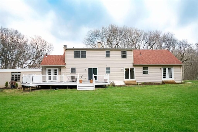 6 Sunrise, Auburn, MA 01501 - rear view of house with a wooden deck, entry steps, a chimney, a yard, and french doors
