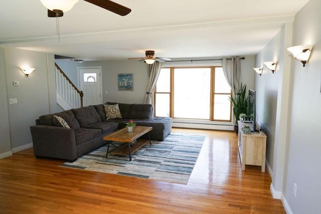 6 Sunrise, Auburn, MA 01501 - living area featuring ceiling fan, wood finished floors, stairway, and baseboards