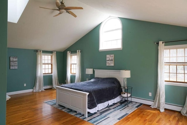 6 Sunrise, Auburn, MA 01501 - bedroom featuring vaulted ceiling, wood finished floors, baseboard heating, baseboards, and a baseboard heating unit