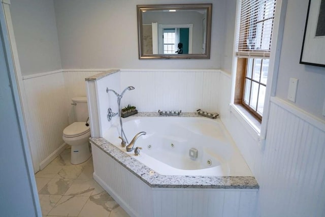 6 Sunrise, Auburn, MA 01501 - full bathroom featuring a wainscoted wall, marble look tiles, toilet, a whirlpool tub, and plenty of natural light