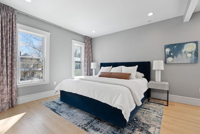 bedroom featuring baseboards, recessed lighting, and light wood-style floors