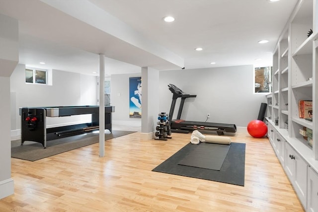 workout area with recessed lighting, baseboards, and light wood finished floors