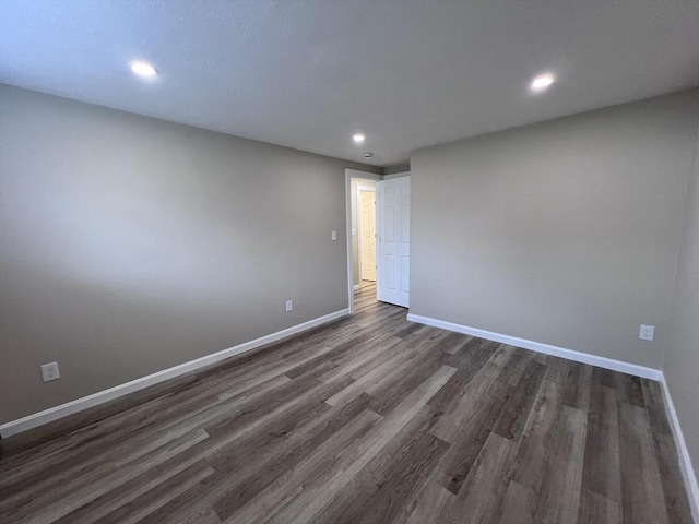 12 Woodland St Unit 12, Everett, MA 02149 - empty room with baseboards, dark wood-style flooring, and recessed lighting