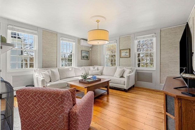 228 Main St, Groton, MA 01450 - living area with light wood finished floors and a wall mounted air conditioner