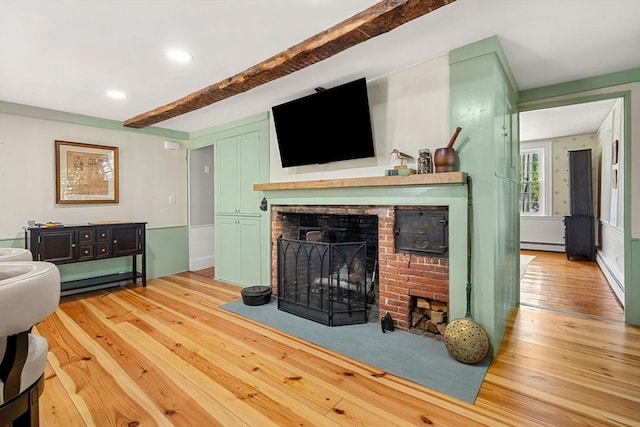 228 Main St, Groton, MA 01450 - living area featuring baseboard heating, a fireplace, beamed ceiling, light wood finished floors, and recessed lighting