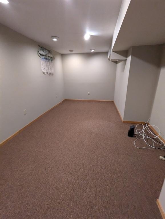 finished below grade area with carpet flooring and baseboards