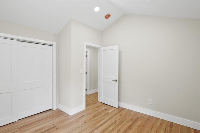 unfurnished bedroom featuring light wood-type flooring and baseboards