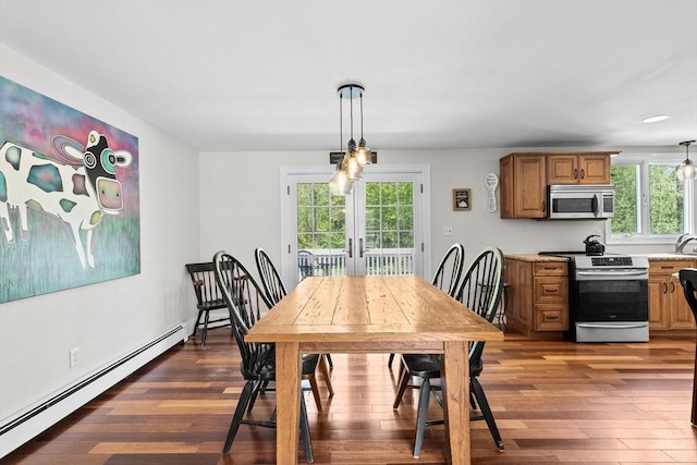 59 First Parish Rd, Norwell, MA 02061 - dining space featuring a baseboard radiator, french doors, and dark wood finished floors