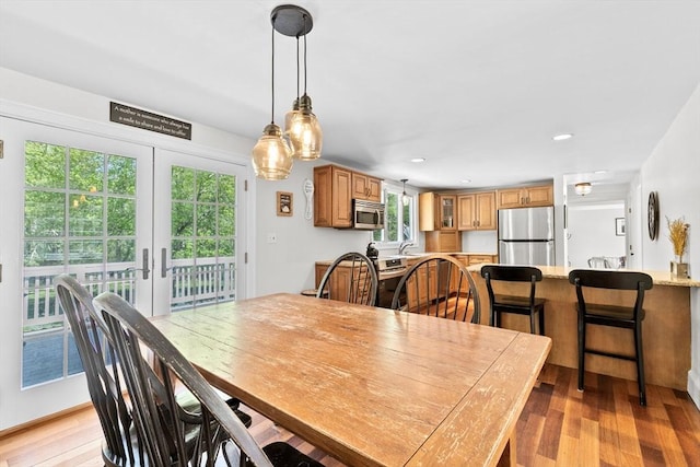 59 First Parish Rd, Norwell, MA 02061 - dining area with light wood-style floors, recessed lighting, and french doors