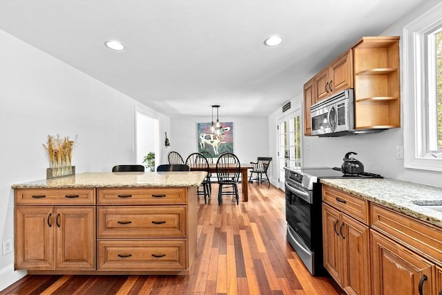59 First Parish Rd, Norwell, MA 02061 - kitchen with appliances with stainless steel finishes, wood-type flooring, open shelves, hanging light fixtures, and recessed lighting