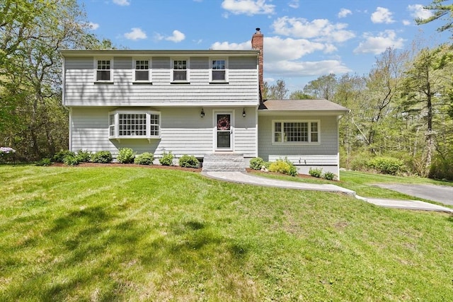 59 First Parish Rd, Norwell, MA 02061 - colonial home featuring a chimney and a front lawn