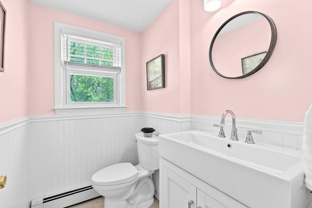 59 First Parish Rd, Norwell, MA 02061 - bathroom featuring a baseboard heating unit, a wainscoted wall, and vanity