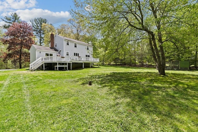 59 First Parish Rd, Norwell, MA 02061 - view of green lawn featuring a wooden deck and stairs