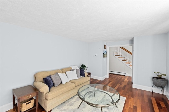 59 First Parish Rd, Norwell, MA 02061 - living room with baseboard heating, stairway, and wood finished floors