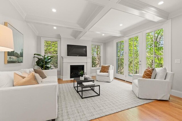 living room featuring wood finished floors, beamed ceiling, recessed lighting, a fireplace, and baseboards