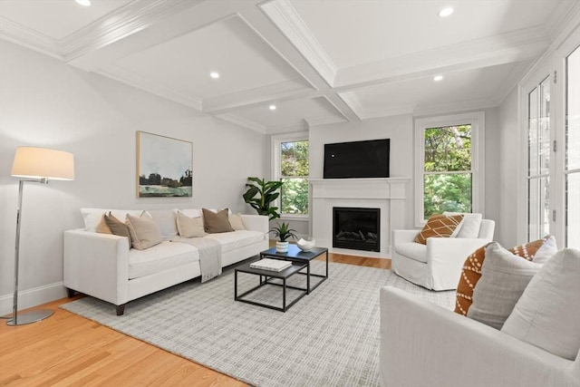 living area with healthy amount of natural light, wood finished floors, beam ceiling, baseboards, and recessed lighting