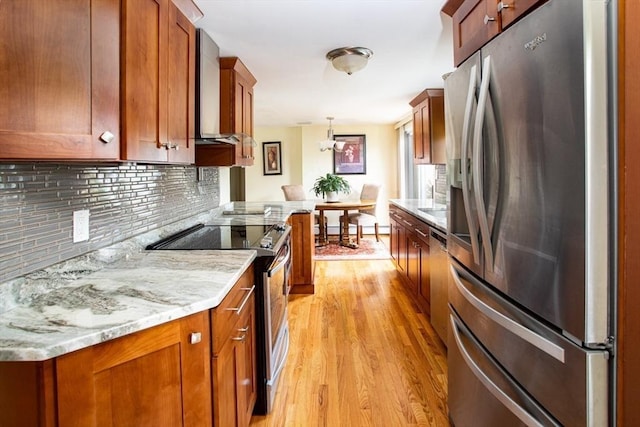136 Maryland Ave, Somerset, MA 02726 - kitchen featuring stainless steel appliances, light wood-type flooring, wall chimney exhaust hood, decorative backsplash, and brown cabinetry