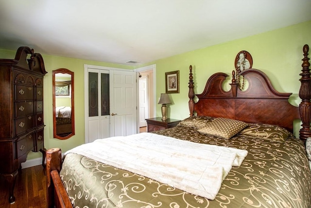 136 Maryland Ave, Somerset, MA 02726 - bedroom with dark wood finished floors, baseboards, and a closet