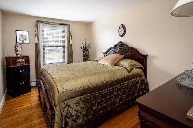 136 Maryland Ave, Somerset, MA 02726 - bedroom featuring wood finished floors and a baseboard heating unit