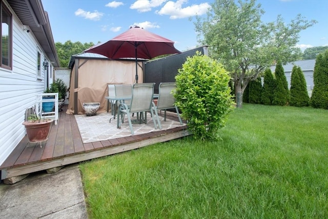 136 Maryland Ave, Somerset, MA 02726 - view of green lawn featuring a wooden deck