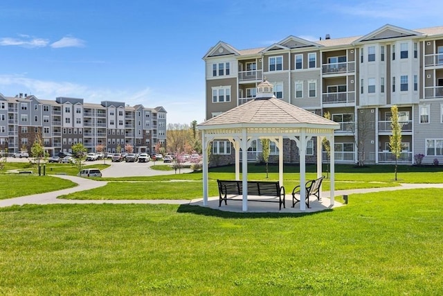 view of property's community with a gazebo and a lawn