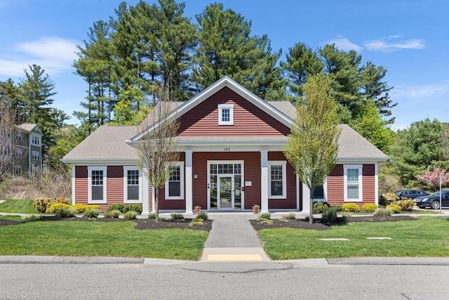 view of front of house featuring a porch and a front lawn