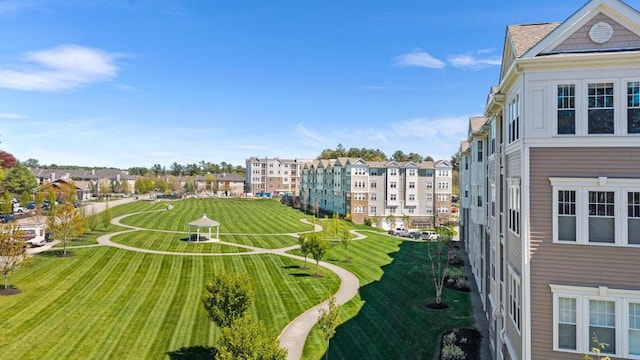 view of property's community with a yard