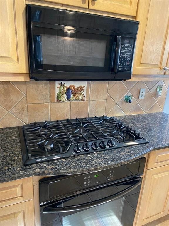 135-137 Summer St, Waltham, MA 02452 - kitchen view of black appliances, light brown cabinets, decorative backsplash, and dark stone counters