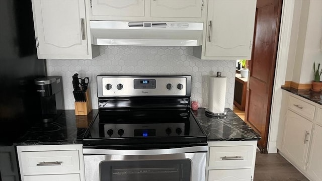 135-137 Summer St, Waltham, MA 02452 - kitchen featuring under cabinet range hood, stainless steel electric stove, white cabinets, and dark stone counters