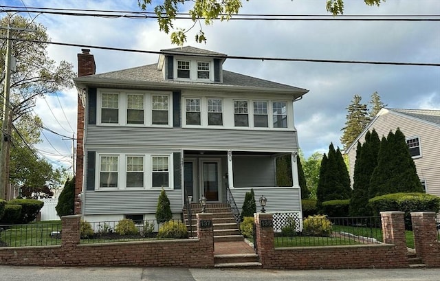 135-137 Summer St, Waltham, MA 02452 - american foursquare style home featuring covered porch, a chimney, and a shingled roof