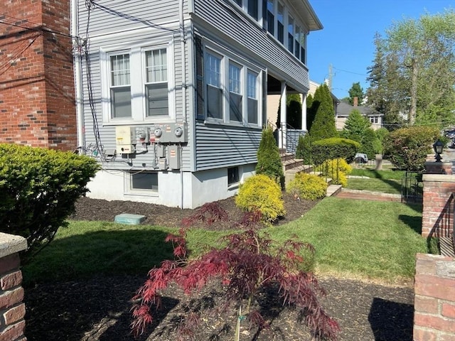 135-137 Summer St, Waltham, MA 02452 - view of side of home with a lawn