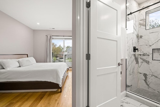 bedroom with multiple windows, light marble finish flooring, baseboards, and recessed lighting