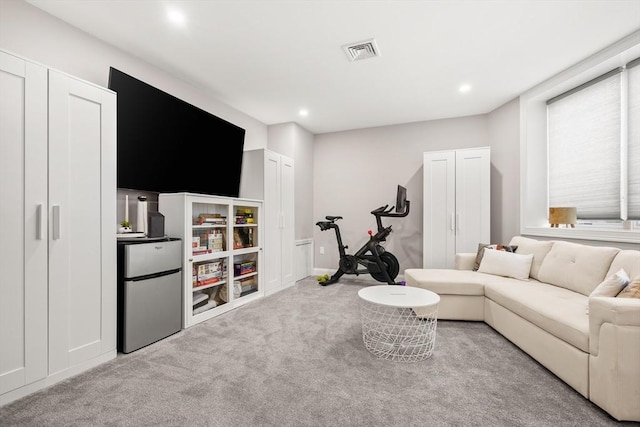carpeted living room featuring recessed lighting
