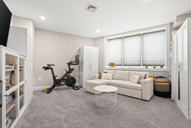 living room with carpet floors, baseboards, and recessed lighting