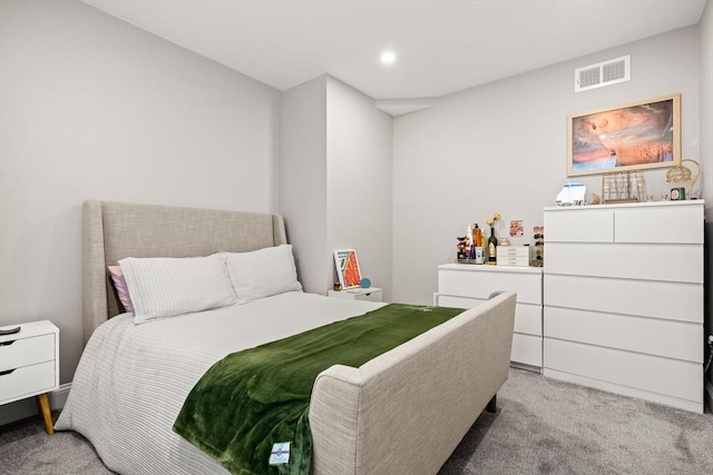 bedroom with light colored carpet and recessed lighting