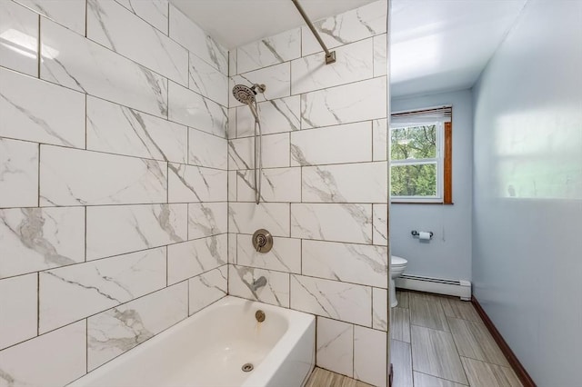 full bathroom featuring baseboard heating, bathing tub / shower combination, and toilet