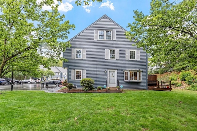 10 Oak Ridge Dr Unit 6, Maynard, MA 01754 - back of house with a yard, entry steps, a deck, and uncovered parking