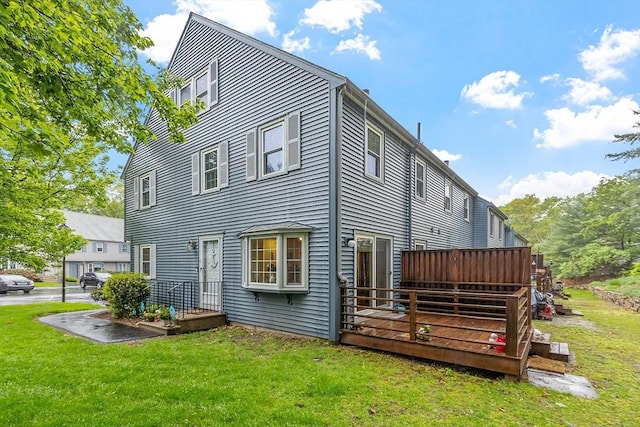 10 Oak Ridge Dr Unit 6, Maynard, MA 01754 - back of property with a lawn and a wooden deck