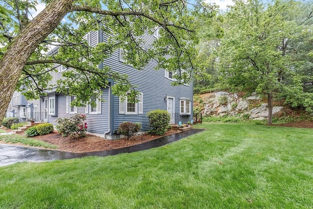 10 Oak Ridge Dr Unit 6, Maynard, MA 01754 - view of property exterior featuring a lawn and a chimney